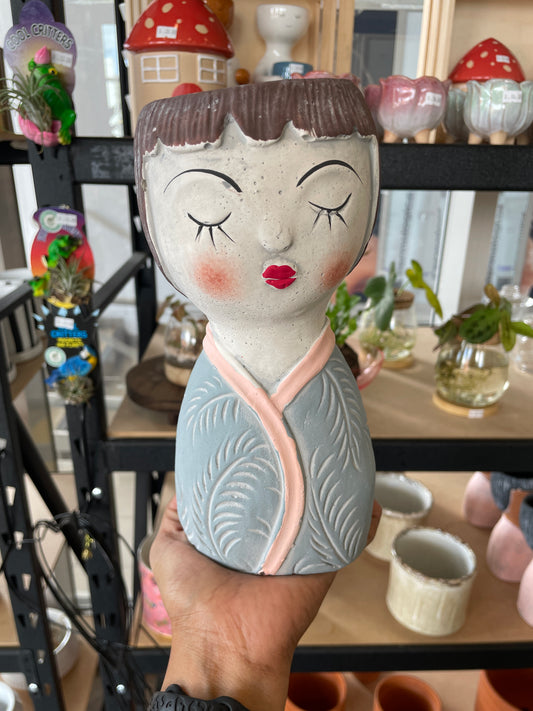 girl-pot-closing-eyes-cement