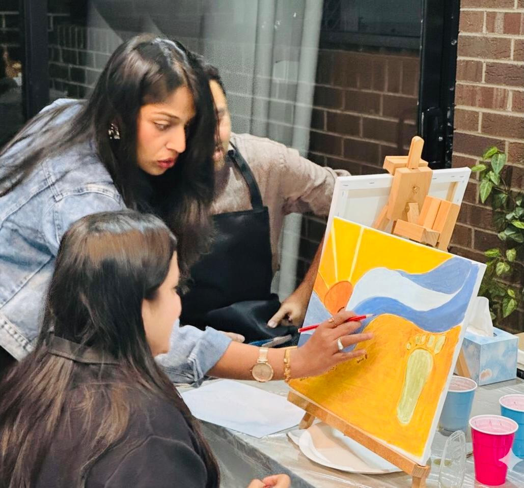 Tejal Venkataswamy guiding a Brush & Buzz painting workshop focused on creativity, relaxation, and connection.